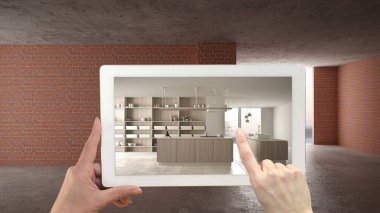 Artırılmış gerçeklik kavramı. İç şantiyede mobilya ve tasarım ürünleri simüle etmek için kullanılan Ar uygulaması ile el tutma tablet, ada ile modern beyaz mutfak