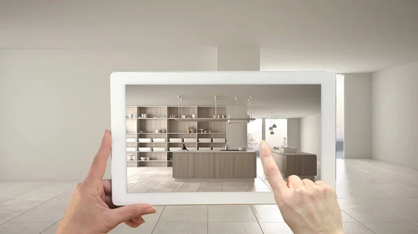 Koncepcja rozszerzonej rzeczywistości. Ręczny tablet z aplikacją AR używaną do symulacji mebli i produktów projektowych w pustych wnętrzach z ceramiczną podłogą, nowoczesną białą kuchnią — Zdjęcie stockowe
