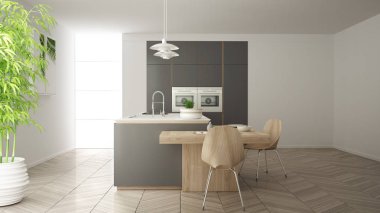 Modern temiz çağdaş gri mutfak, sandalye, bambu ve saksı bitkileri, büyük pencere ve ringa kemiği parke zemin, minimalist iç tasarım ile ahşap yemek masası