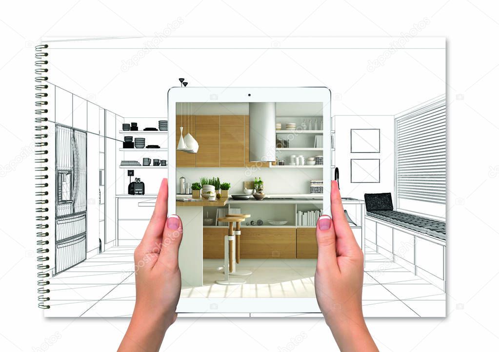 Hands holding tablet showing kitchen, notebook with blueprint sketch in the background, augmented reality concept, application to simulate furniture and interior design products