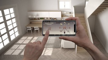 Dijital akıllı telefon tabletinde uzaktan ev kontrol sistemi. Uygulama simgeleri içeren aygıt. Arka planda merdiven ile minimalist mutfak Iç, mimari tasarım, üst görünümü