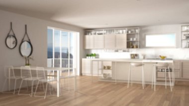 Bulanıklık arka plan iç tasarım, penthouse minimalist mutfak iç tasarım, yemek masası, tabureler, parke ile ada. Modern mimari kavram fikri