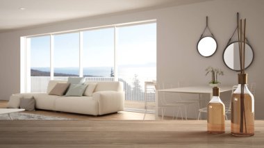 Kanepe ve büyük panoramik pencere, beyaz mimari iç tasarım ile bulanık modern beyaz oturma odası üzerinde aromatik sopa şişeleri ile ahşap masa üst veya raf