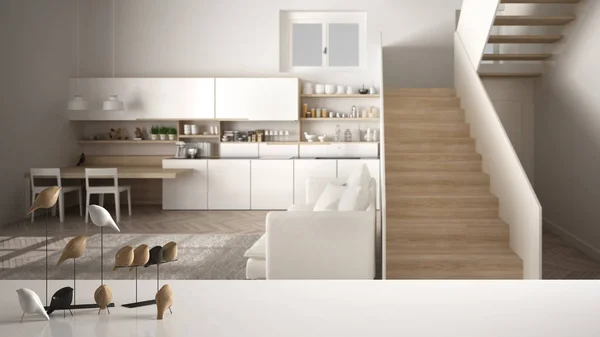 Λευκό τραπέζι επάνω ή ράφι με μινιμαλιστικό στολίδι πουλιών, Μπέρντι Νικ-δεξιότητα πάνω από θολή σύγχρονη λευκή και ξύλινη κουζίνα με μοντέρνα σκάλα, αρχιτεκτονική εσωτερικό σχεδιασμό — Φωτογραφία Αρχείου