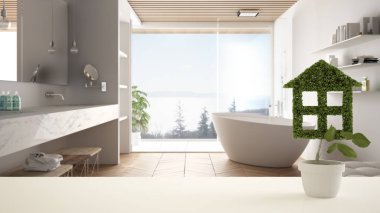 Beyaz masa üst veya raf ev şeklinde saksı yeşil bitki, arka planda küvet ile minimalist banyo, iç tasarım, gayrimenkul, eko mimari konsept fikir