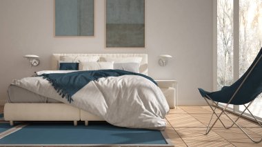 Modern mavi renkli minimalist yatak odası, yastık ve battaniye, parke, başucu masaları ve halı ile yatak. Ağaçlar ve kar ile kış panoraması ile panoramik pencere, iç tasarım