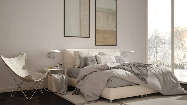 Moderno dormitorio minimalista blanco y gris, cama con almohadas y mantas, parquet, mesitas de noche y alfombra. Ventana panorámica con panorama invernal con árboles y nieve, interiorismo —  Fotos de Stock