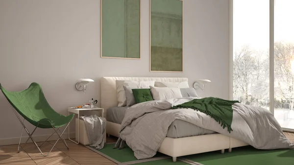 Moderno dormitorio minimalista de color verde, cama con almohadas y mantas, parquet, mesitas de noche y alfombra. Ventana panorámica con panorama invernal con árboles y nieve, interiorismo —  Fotos de Stock