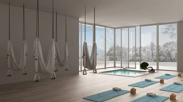 Empty yoga studio interior design, minimal open space with mats, hammocks and accessories, spa pool, bonsai, ready for yoga practice, panoramic window with winter panorama