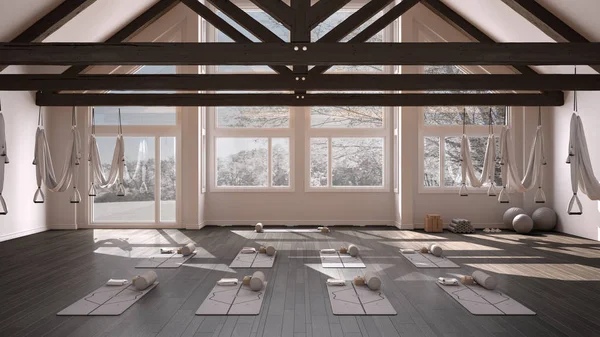 Empty yoga studio interior design, space with hammock, mats, pillows and accessories, wooden floor and roof, ready for yoga practice, meditation, panoramic window with winter panorama