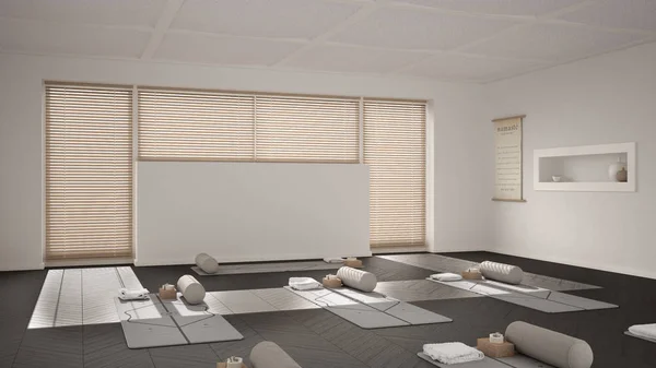 Empty yoga studio interior design, open space with mats, pillows and accessories, venetian bamboo blinds, herringbone parquet, big window, ready for yoga practice, meditation room