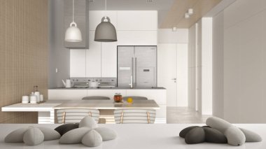 Beyaz masa, masa ya da raf. Üzerinde yıldızlar ya da çiçek şeklinde beş yumuşak beyaz yastık var. Bulanık modern yemek odası, mutfak, iç mimari tasarım.