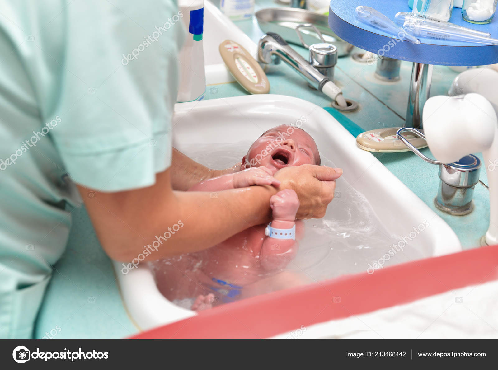 Nurse Giving Baby First Bath