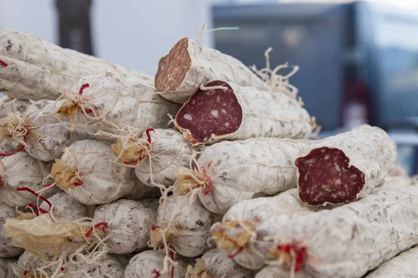 Smoked sausages on the counter of the French market — Stock Photo, Image