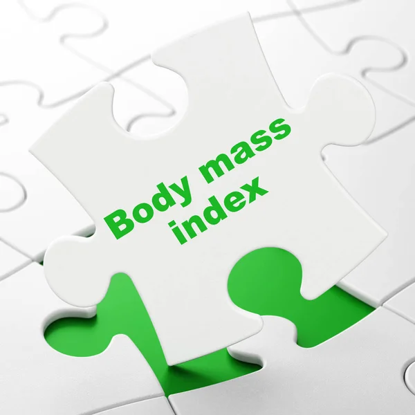 Концепция медицины: Индекс массы тела на фоне головоломок — стоковое фото