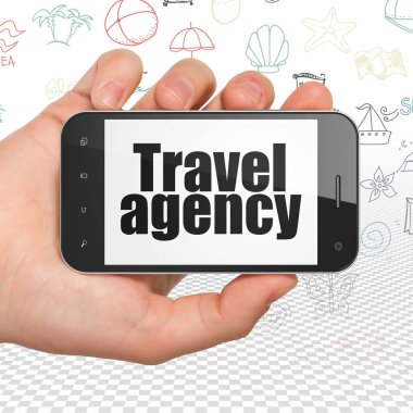 Tatil kavramı: el Smartphone ile seyahat acentası ekranda Holding
