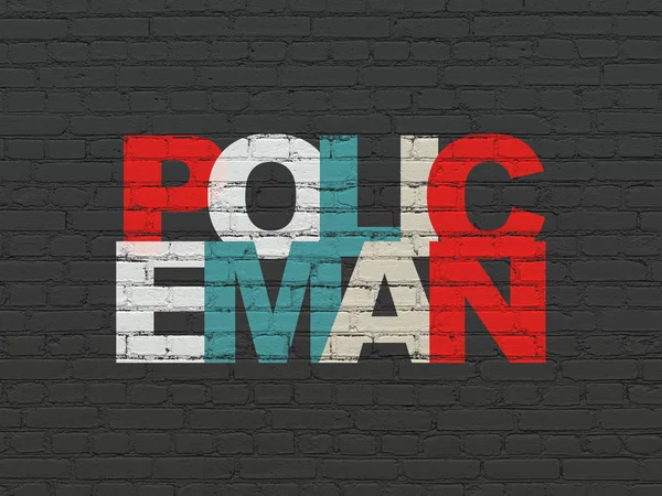 Law concept: Policeman on wall background