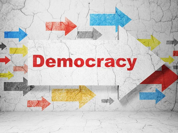 Politik-konceptet: pil med demokrati på grunge vägg bakgrund — Stockfoto