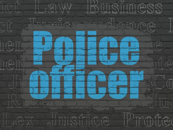 Έννοια του νόμου: αξιωματικός της αστυνομίας, σε φόντο τοίχο — Φωτογραφία Αρχείου