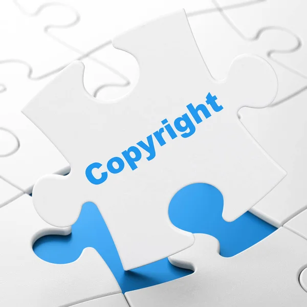 Концепція права: Авторське право на фоні головоломки — стокове фото