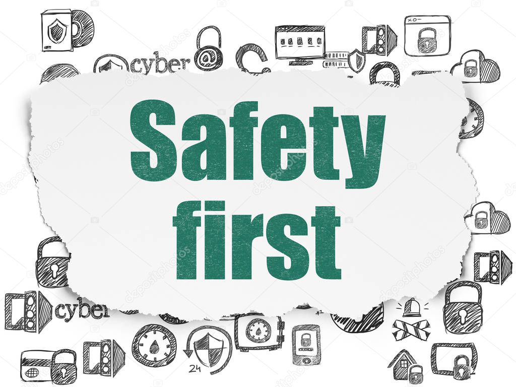 Protection concept: Safety First on Torn Paper background