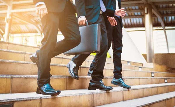 defocused or blured Businessman walking the stairs with city background, Businessmen go to success concept, vintage style.