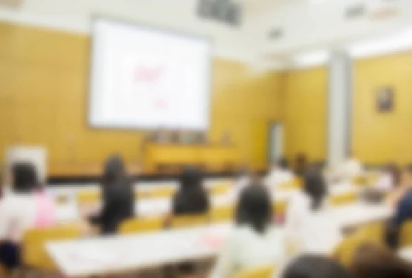 Blurred background of business people in conference hall or seminar room, business people concept.
