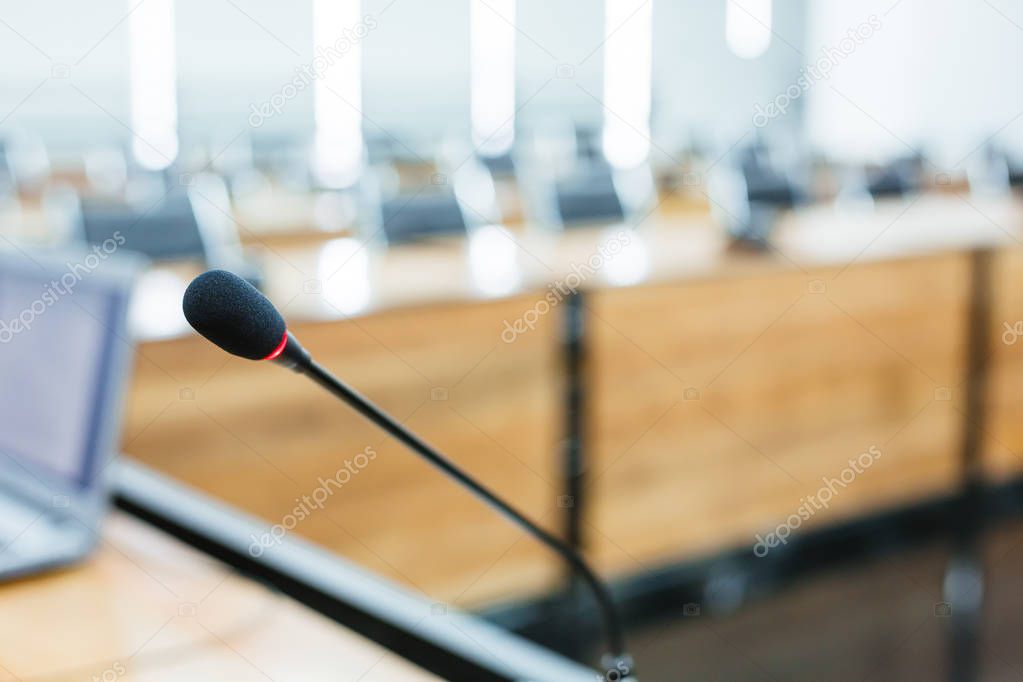 Microphone over the blurred business forum Meeting or Conference Training Learning Coaching Room Concept, Blurred background