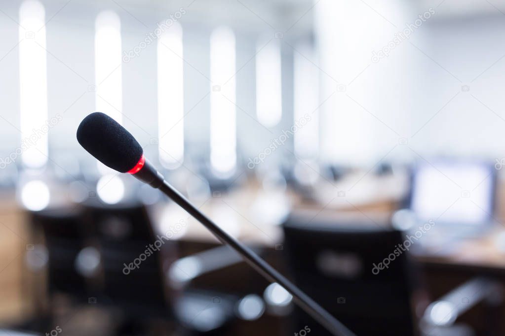 Microphone over the blurred business forum Meeting or Conference Training Learning Coaching Room Concept, Blurred background