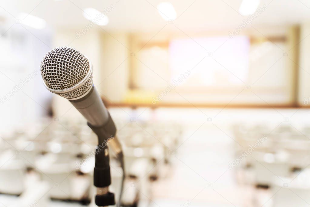 Microphone over the blurred business forum Meeting or Conference Training Learning Coaching Room Concept, Blurred background