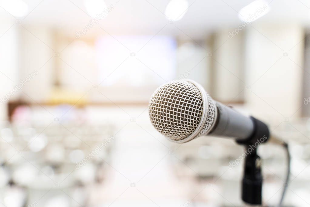 Microphone over the blurred business forum Meeting or Conference Training Learning Coaching Room Concept, Blurred background