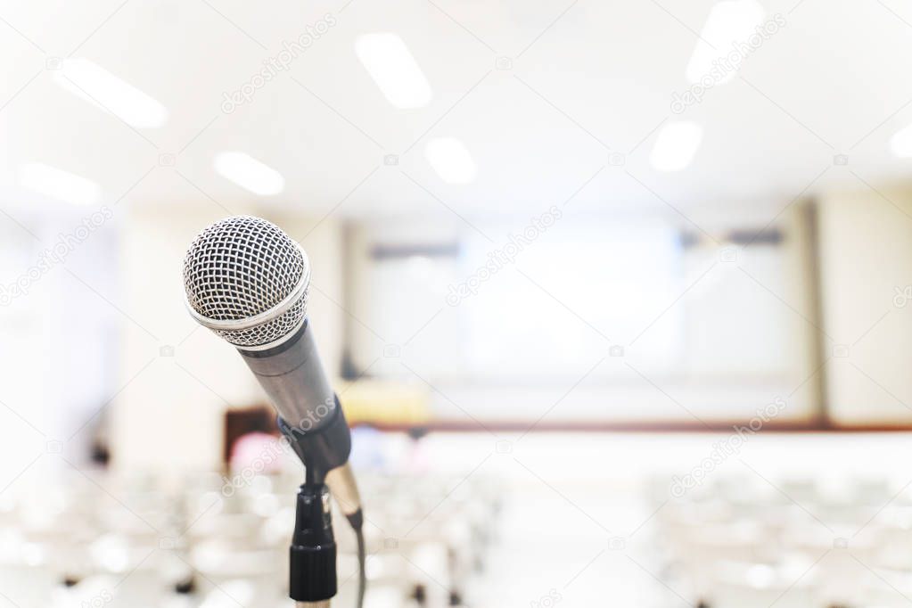 Microphone over the blurred business forum Meeting or Conference Training Learning Coaching Room Concept, Blurred background