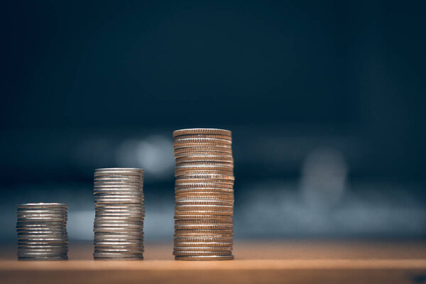 step of coins stacks, money, saving and investment or family planning concept.