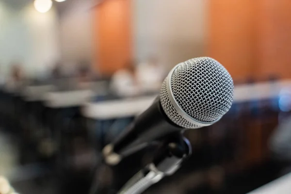 Microphone over the blurred business forum Meeting or Conference Training Learning Coaching Room Concept, Blurred background.