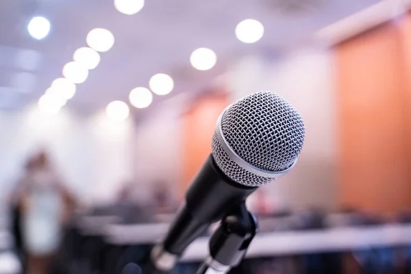 Microphone over the blurred business forum Meeting or Conference Training Learning Coaching Room Concept, Blurred background.