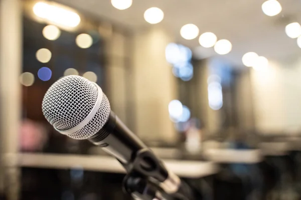 Microphone over the blurred business forum Meeting or Conference Training Learning Coaching Room Concept, Blurred background.