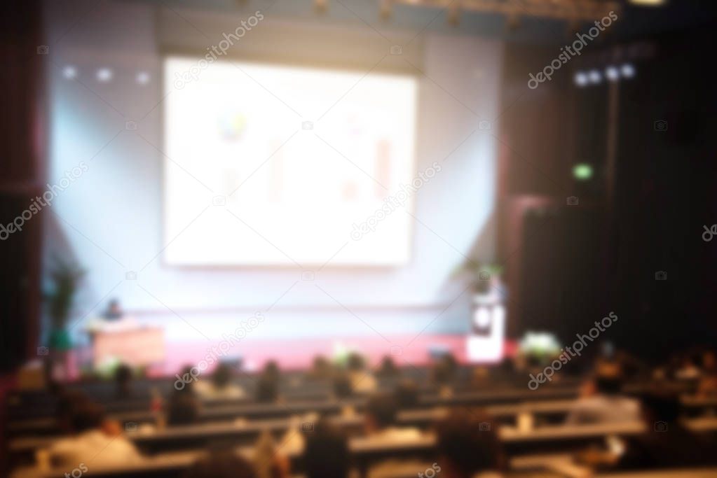 Blurred background of business people in conference hall or seminar room.