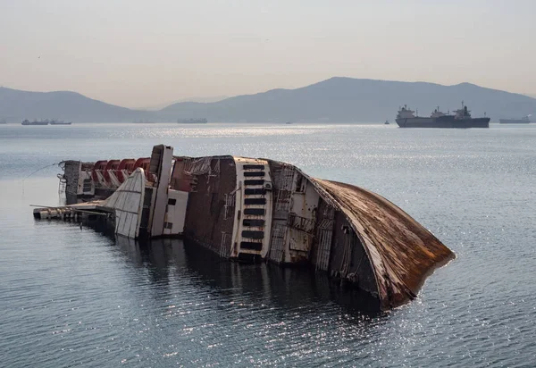 Big sunken ship Mediterranean Sky (shipwreck) off the coast of Greece at sunset