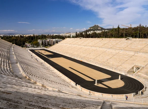 View of the ancient stadium of the first Olympic Games in white marble -Panathenaic Stadium - overlooking Lykavitos hill in the city of Athens, Greece