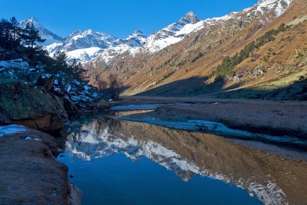 Caucasus Mountains reflected mountain peaks in the water