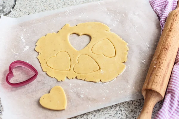 Baking delicious love heart cookies for Valentine day. Top view