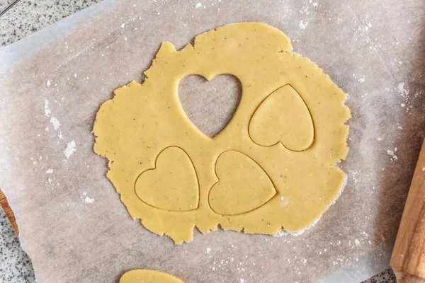 Baking delicious love heart cookies for Valentine day. Top view