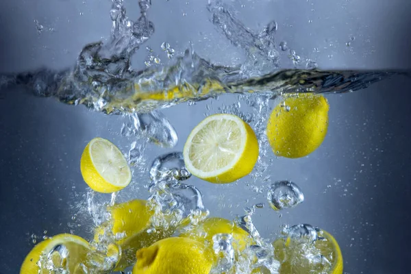 Lemons fresh splash in water yellow fruit food
