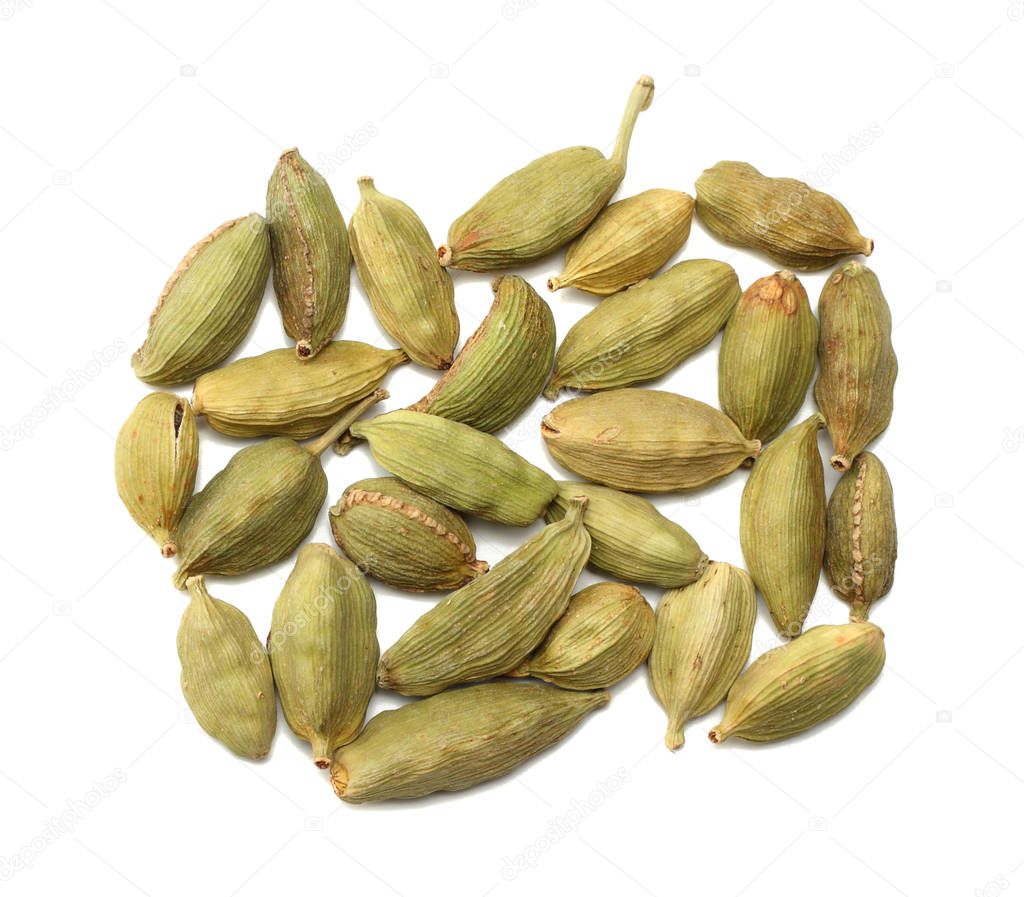 Pile of green Cardamom, cardamon or cardamum (dried fruits of Elettaria cardamomum) isolated on white. shadow separated top view