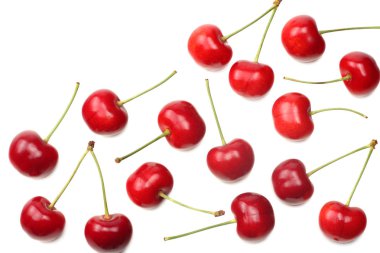 Kırmızı kiraz beyaz arka planda izole edilmiş. Üst görünüm