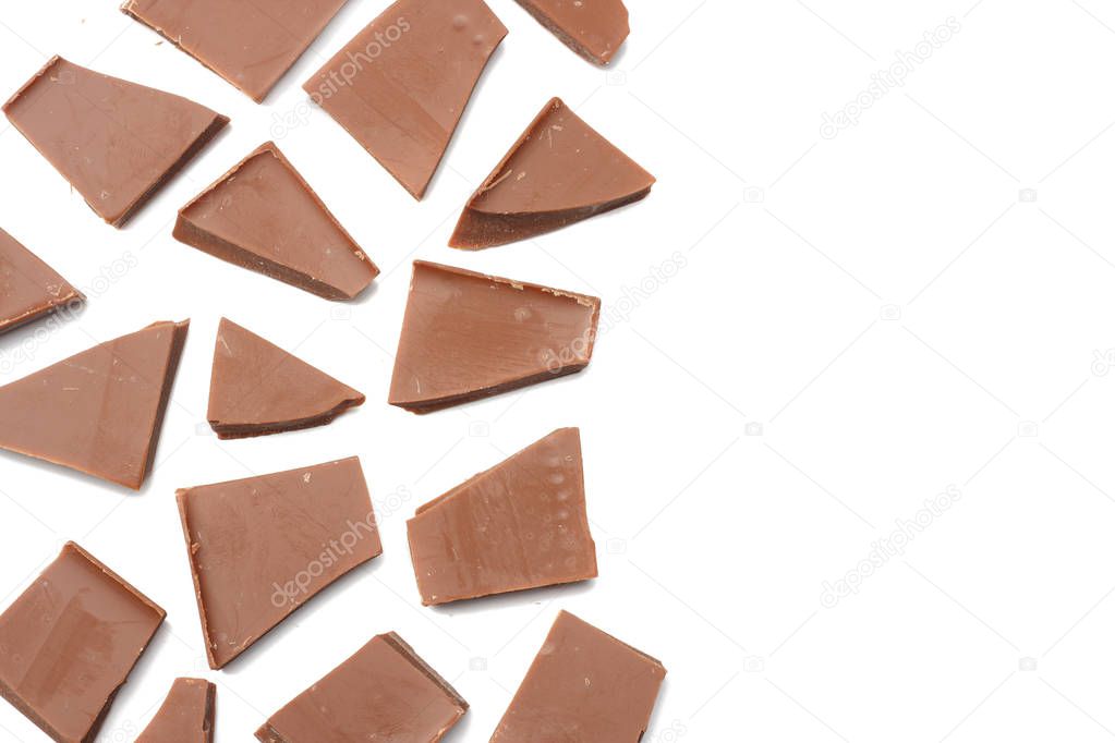 cracked chocolate candies sweets isolated on white background top view
