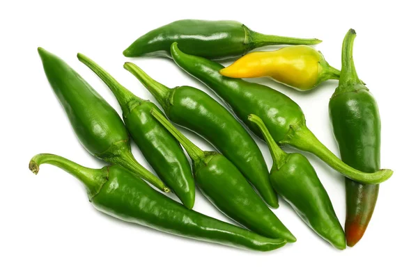 green hot chili peppers isolated on white background top view