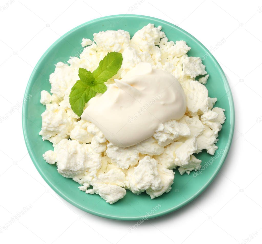 cottage cheese in blue bowl isolated on white background top view