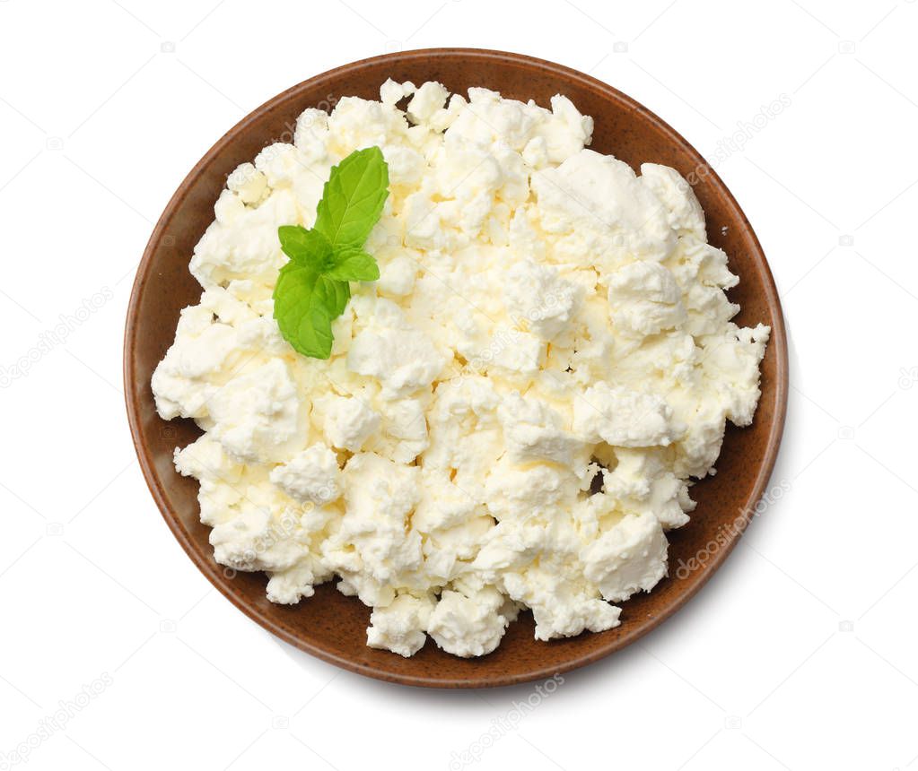 cottage cheese in brown bowl isolated on white background top view