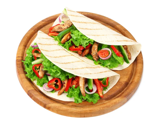 Tortilla wrap with fried chicken meat and vegetables on wooden board isolated on white background — Stock Photo, Image